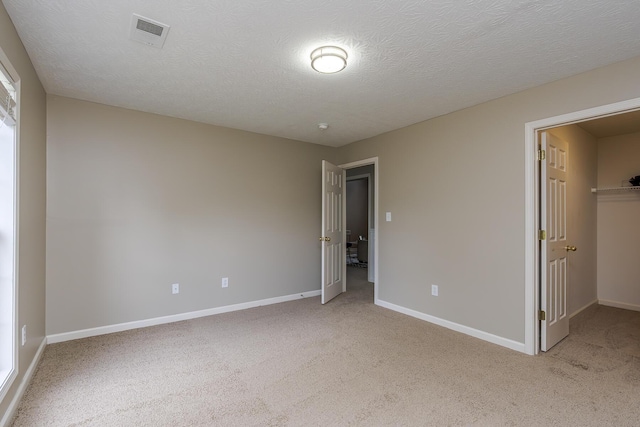 164 Strawberry Fields Rd, Lexington, KY 40516 - unfurnished bedroom featuring light colored carpet, baseboards, and a textured ceiling