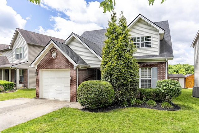 164 Strawberry Fields Rd, Lexington, KY 40516 - traditional home featuring brick siding, an attached garage, driveway, and a shingled roof