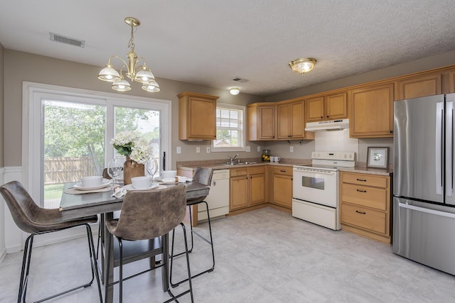 164 Strawberry Fields Rd, Lexington, KY 40516 - kitchen featuring white appliances, under cabinet range hood, light countertops, a chandelier, and decorative light fixtures