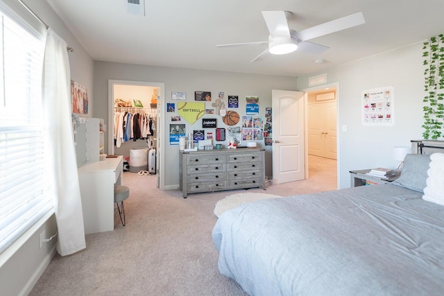 133 Kirkstall Way, Georgetown, KY 40324 - bedroom featuring light colored carpet, multiple windows, a walk in closet, and a ceiling fan