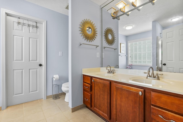 481 Alderbrook Way, Lexington, KY 40515 - bathroom with double vanity, toilet, tile patterned flooring, a textured ceiling, and baseboards
