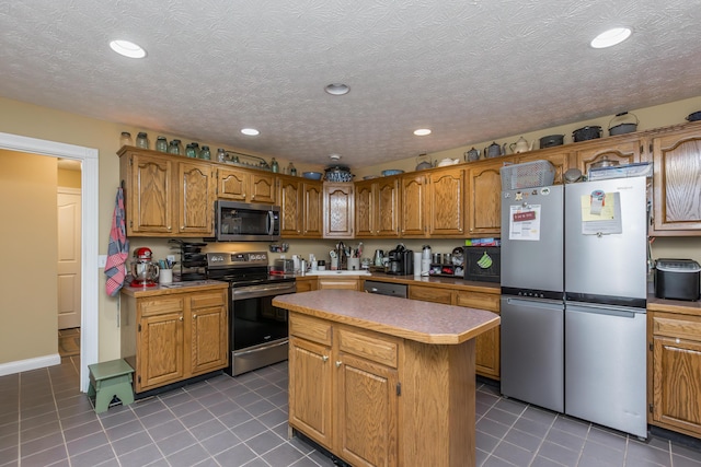 53 Douglas Ave, Stanford, KY 40484 - kitchen with appliances with stainless steel finishes, tile patterned flooring, brown cabinetry, and recessed lighting