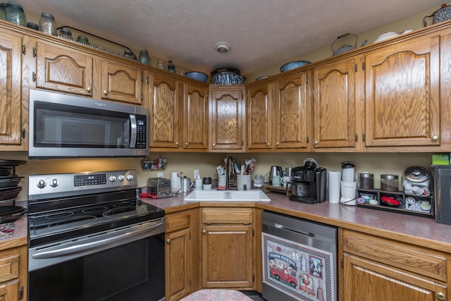 53 Douglas Ave, Stanford, KY 40484 - kitchen featuring appliances with stainless steel finishes, a sink, and brown cabinets