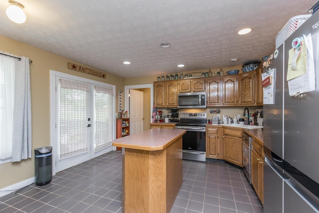 53 Douglas Ave, Stanford, KY 40484 - kitchen featuring stainless steel appliances, a sink, light countertops, a kitchen island, and recessed lighting