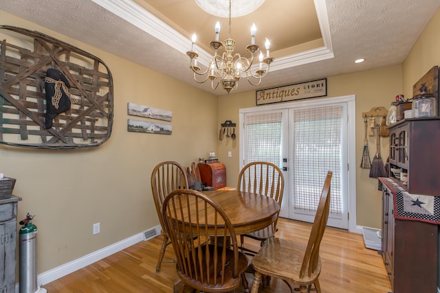 53 Douglas Ave, Stanford, KY 40484 - dining room with light wood-type flooring, a chandelier, a tray ceiling, baseboards, and recessed lighting