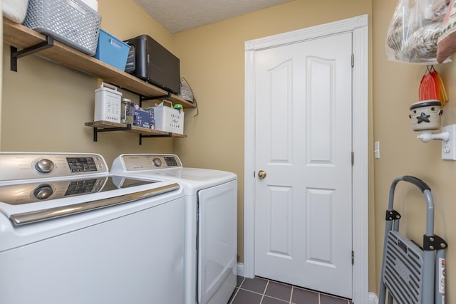 53 Douglas Ave, Stanford, KY 40484 - laundry area featuring washing machine and dryer, dark tile patterned flooring, and baseboards