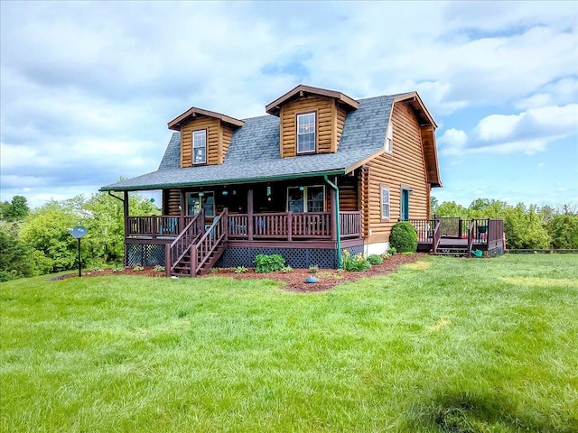 116 Hickory Lick Rd, Richmond, KY 40475 - log-style house with log siding, a shingled roof, a front yard, and covered porch