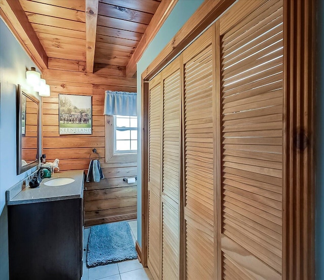 116 Hickory Lick Rd, Richmond, KY 40475 - bathroom with wooden ceiling with exposed beams, wooden walls, tile patterned flooring, and vanity