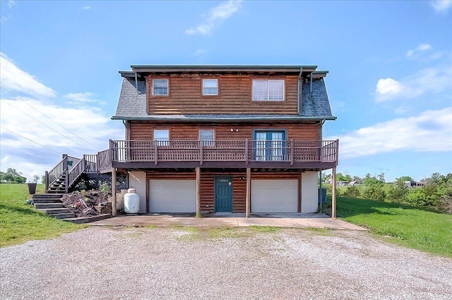 116 Hickory Lick Rd, Richmond, KY 40475 - view of front facade with dirt driveway, a garage, stairs, and log veneer siding