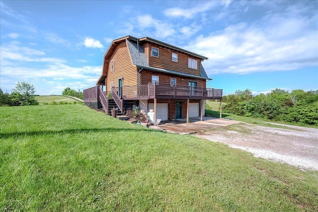 116 Hickory Lick Rd, Richmond, KY 40475 - back of property with driveway, a deck, an attached garage, a yard, and a gambrel roof