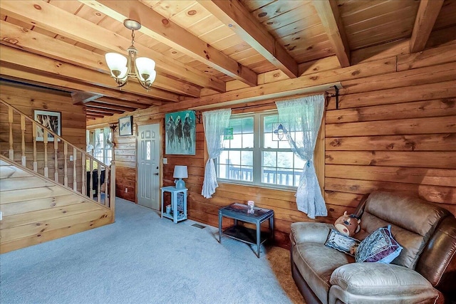 116 Hickory Lick Rd, Richmond, KY 40475 - sitting room with wood walls, a chandelier, carpet floors, wooden ceiling with exposed beams, and stairs