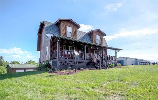 116 Hickory Lick Rd, Richmond, KY 40475 - cabin featuring covered porch, a front lawn, a shingled roof, an outbuilding, and log exterior