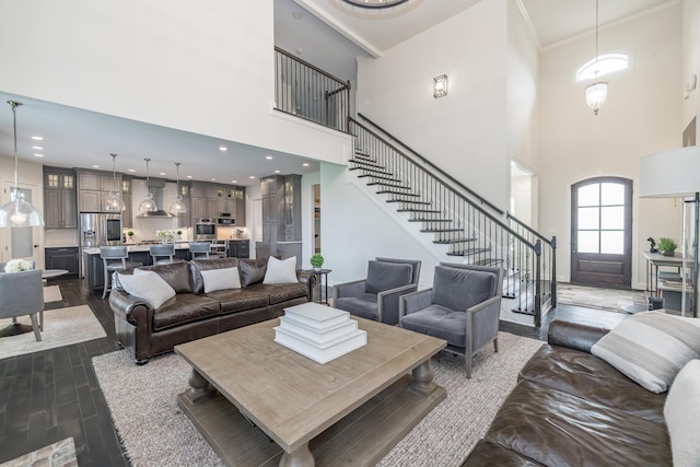 2605 Lucca Pl, Lexington, KY 40509 - living room featuring a towering ceiling, stairway, dark wood-style floors, and ornamental molding
