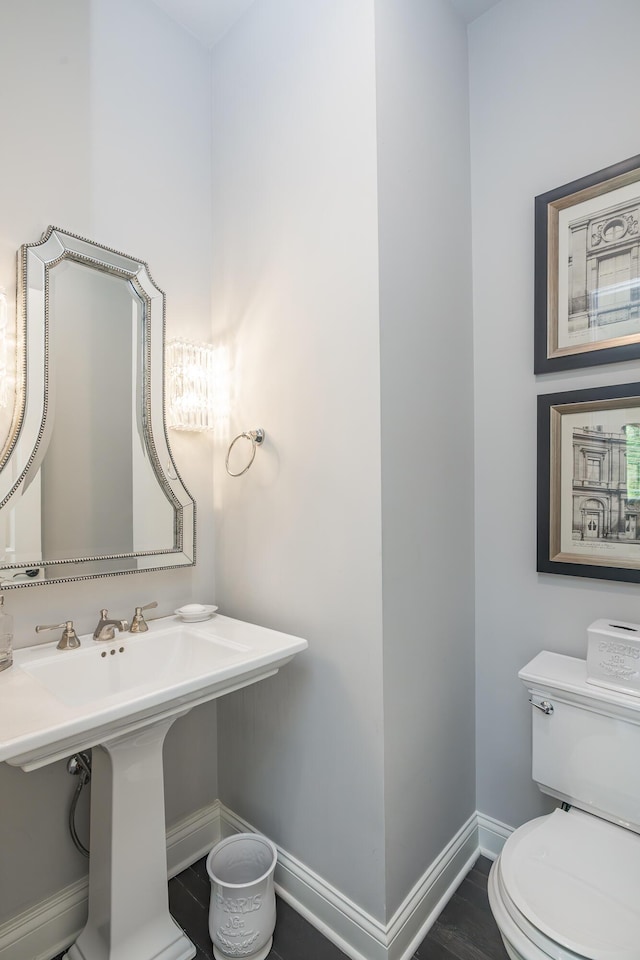 2605 Lucca Pl, Lexington, KY 40509 - half bathroom featuring baseboards, toilet, and wood finished floors