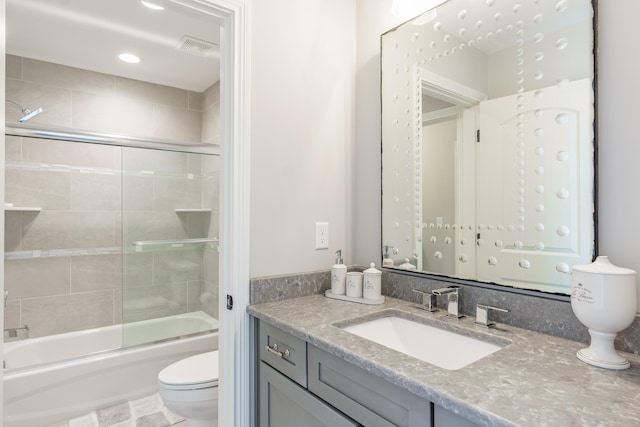 2605 Lucca Pl, Lexington, KY 40509 - bathroom featuring toilet, vanity, and combined bath / shower with glass door