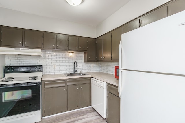 1092 Armstrong Mill Rd Unit A, Lexington, KY 40517 - kitchen featuring white appliances, under cabinet range hood, a sink, light wood-type flooring, and light countertops