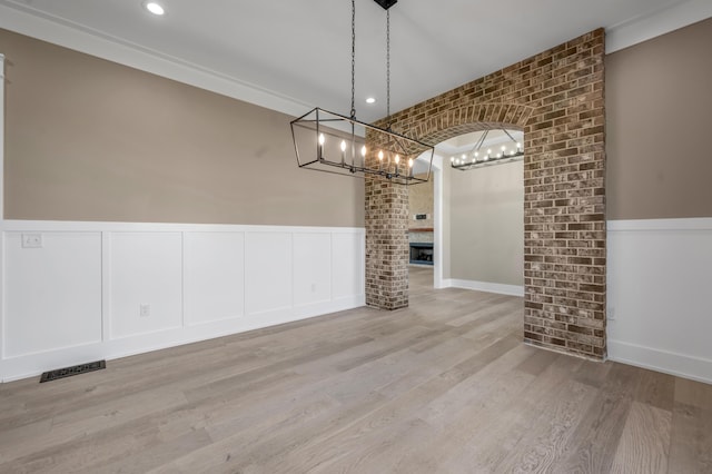 1408 Champion Way, Richmond, KY 40475 - unfurnished dining area featuring a chandelier, a wainscoted wall, wood finished floors, a decorative wall, and recessed lighting