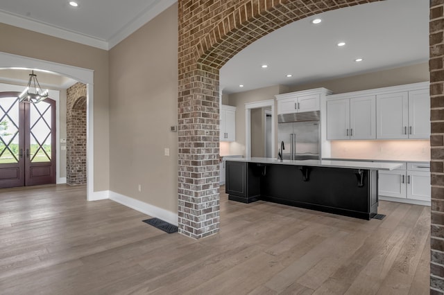 1408 Champion Way, Richmond, KY 40475 - entrance foyer with arched walkways, light wood-style flooring, baseboards, recessed lighting, and a chandelier