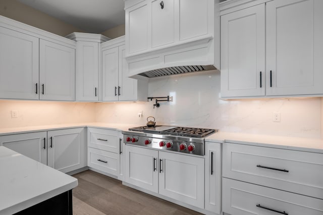 1408 Champion Way, Richmond, KY 40475 - kitchen with stainless steel gas stovetop, light countertops, white cabinetry, tasteful backsplash, and light wood-style floors
