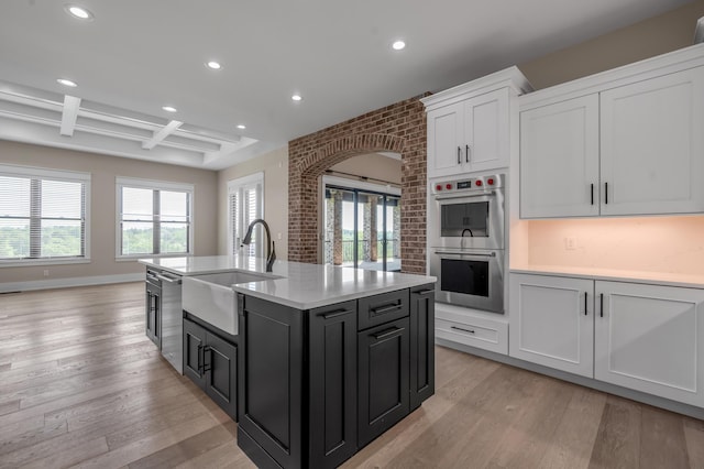 1408 Champion Way, Richmond, KY 40475 - kitchen with stainless steel appliances, a sink, recessed lighting, light wood-type flooring, and light countertops
