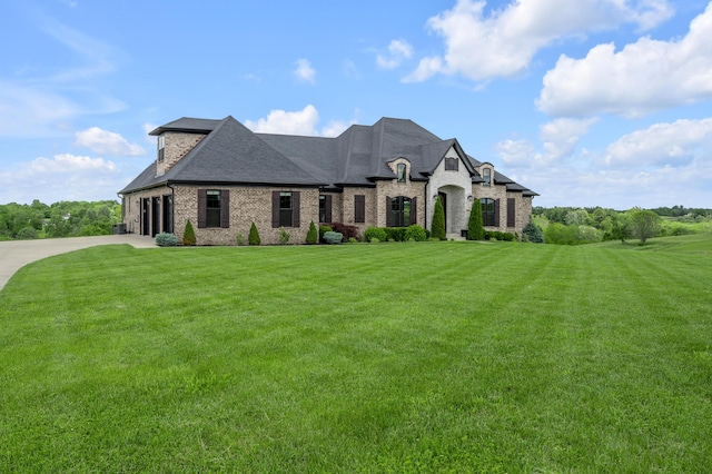 1408 Champion Way, Richmond, KY 40475 - french country style house with brick siding, a front lawn, a shingled roof, and concrete driveway