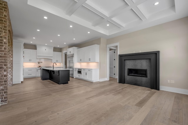 1408 Champion Way, Richmond, KY 40475 - kitchen with coffered ceiling, a kitchen breakfast bar, built in refrigerator, a glass covered fireplace, and open floor plan