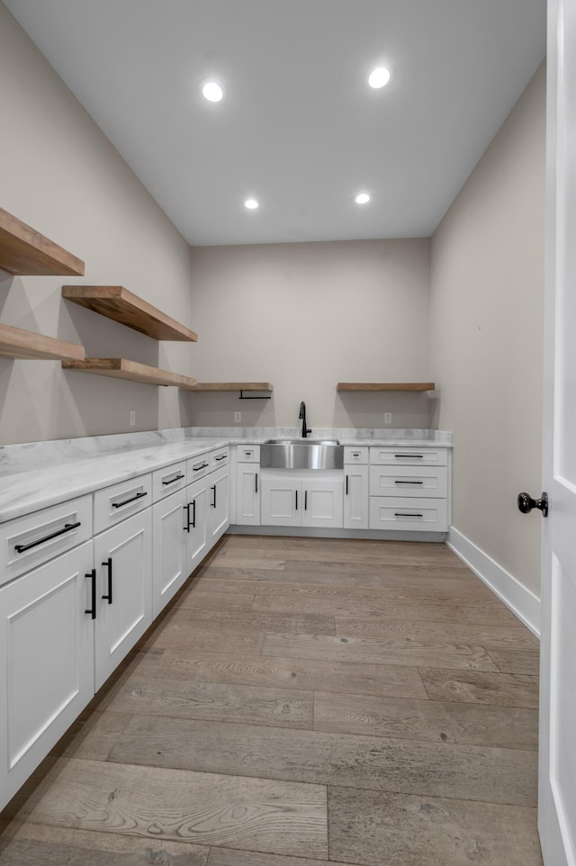 1408 Champion Way, Richmond, KY 40475 - laundry room with a sink, light wood-style floors, recessed lighting, and baseboards