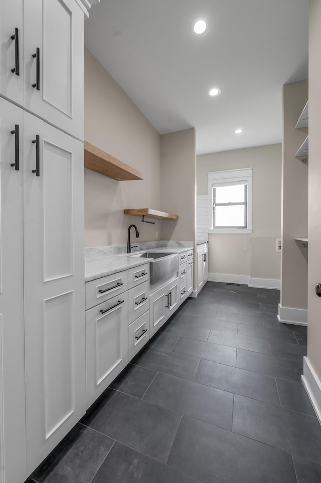 1408 Champion Way, Richmond, KY 40475 - interior space with a sink, baseboards, recessed lighting, and dark tile patterned floors