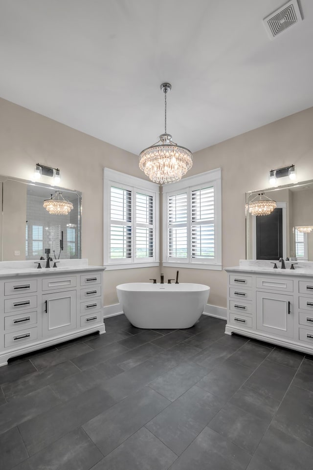1408 Champion Way, Richmond, KY 40475 - full bath with a chandelier, two vanities, a freestanding tub, baseboards, and tile patterned flooring