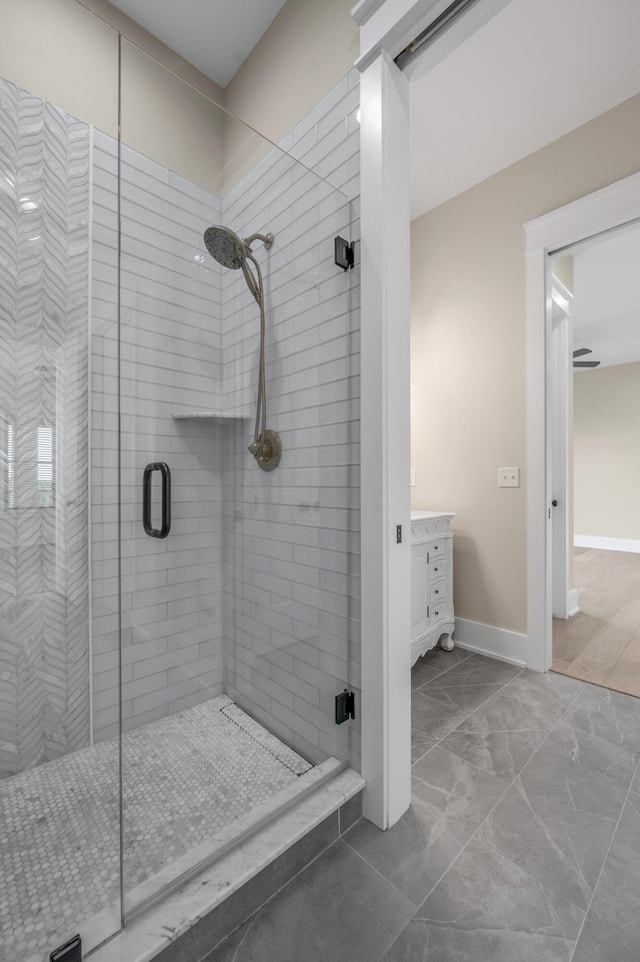 1408 Champion Way, Richmond, KY 40475 - bathroom featuring a shower stall, baseboards, marble finish flooring, and vanity