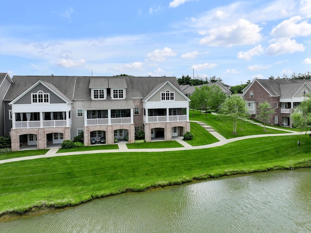 2131 Patchen Lake Ln, Lexington, KY 40505 - back of property with a water view, a balcony, stone siding, and a yard