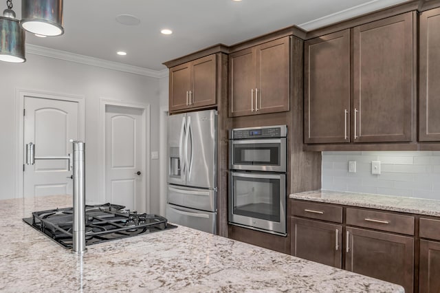 2131 Patchen Lake Ln, Lexington, KY 40505 - kitchen with appliances with stainless steel finishes, crown molding, dark brown cabinets, light stone counters, and decorative backsplash