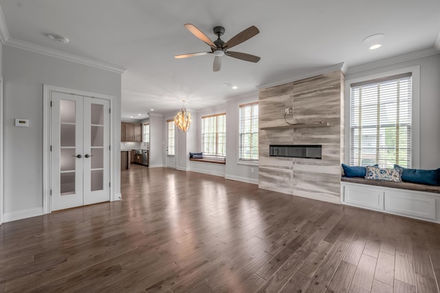 2131 Patchen Lake Ln, Lexington, KY 40505 - unfurnished living room featuring ceiling fan, wood finished floors, a chandelier, a fireplace, and french doors