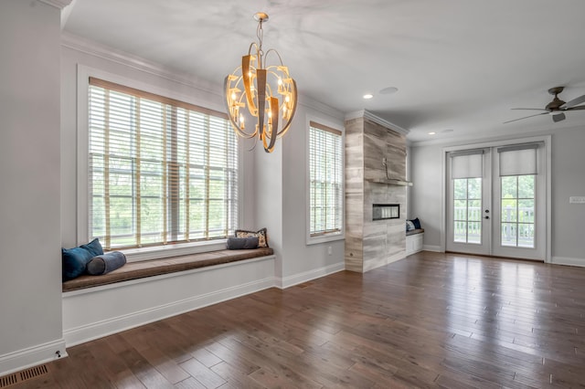 2131 Patchen Lake Ln, Lexington, KY 40505 - living area with a tile fireplace, baseboards, ornamental molding, a chandelier, and wood finished floors