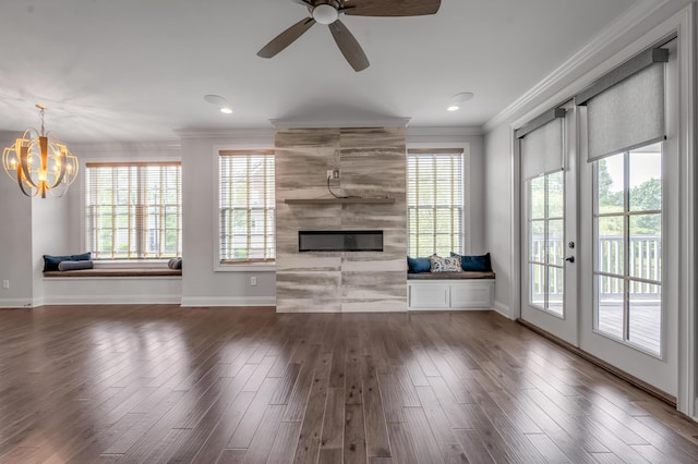 2131 Patchen Lake Ln, Lexington, KY 40505 - unfurnished living room featuring crown molding, plenty of natural light, baseboards, a large fireplace, and wood finished floors
