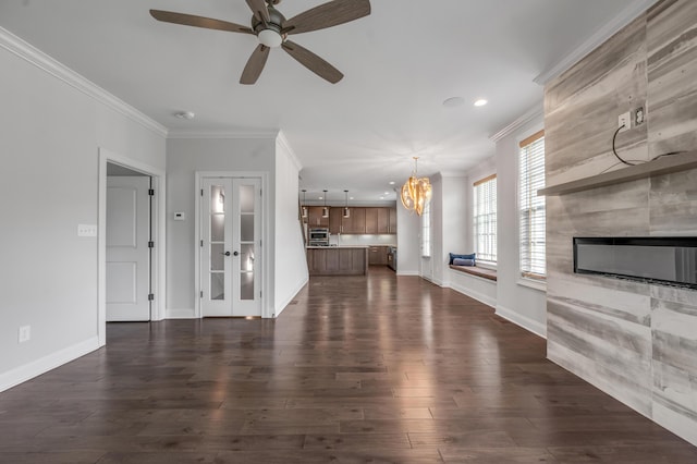 2131 Patchen Lake Ln, Lexington, KY 40505 - unfurnished living room with a chandelier, ceiling fan, a fireplace, dark wood-style flooring, and ornamental molding