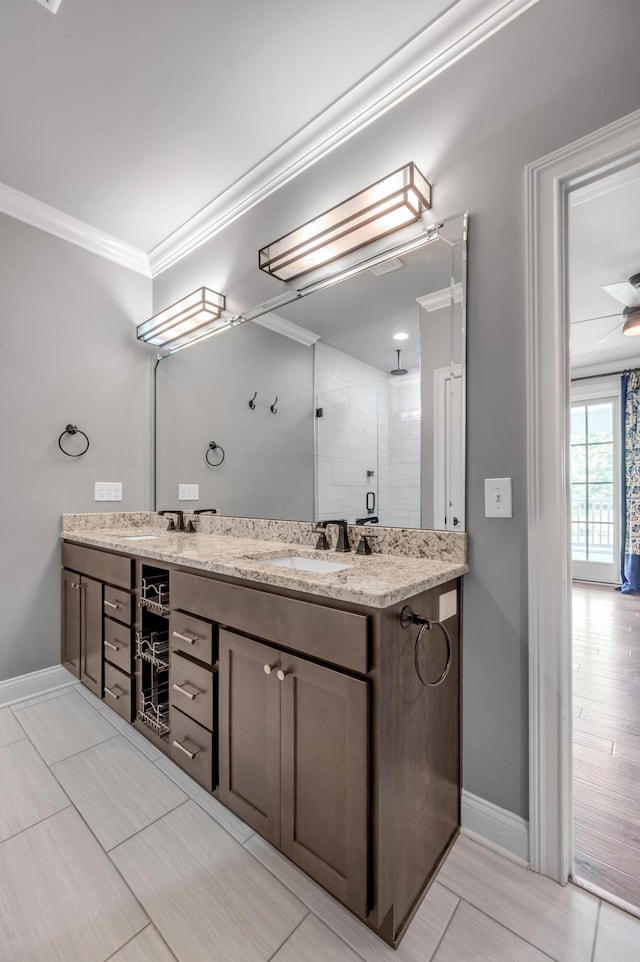 2131 Patchen Lake Ln, Lexington, KY 40505 - full bathroom featuring ornamental molding, double vanity, tiled shower, and baseboards