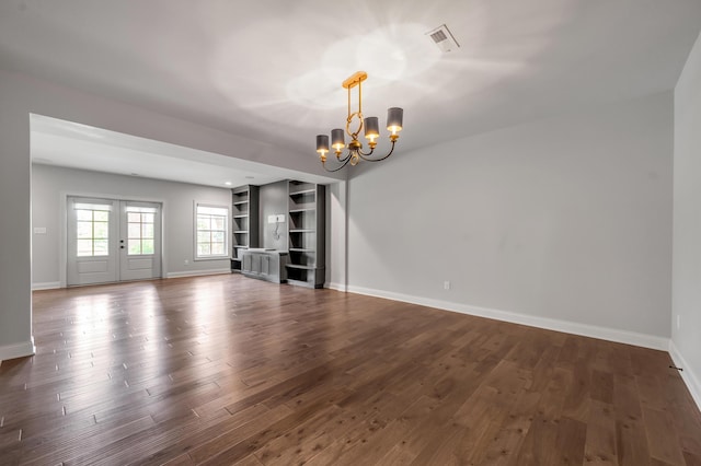 2131 Patchen Lake Ln, Lexington, KY 40505 - unfurnished living room featuring a chandelier, baseboards, and dark wood-style floors