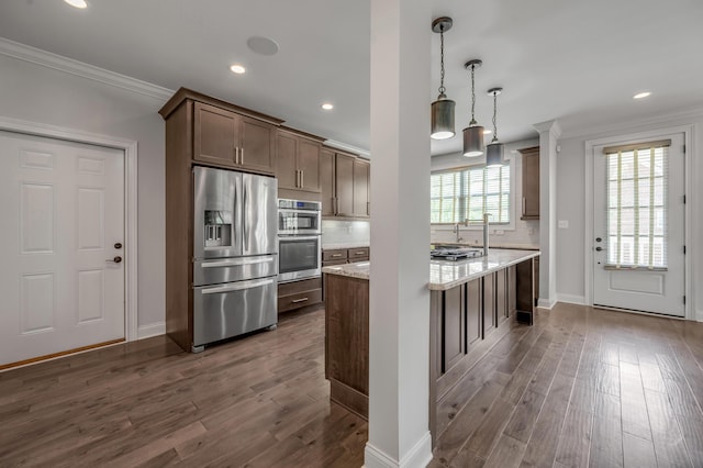 2131 Patchen Lake Ln, Lexington, KY 40505 - kitchen with stainless steel appliances, crown molding, dark wood-type flooring, baseboards, and light stone counters
