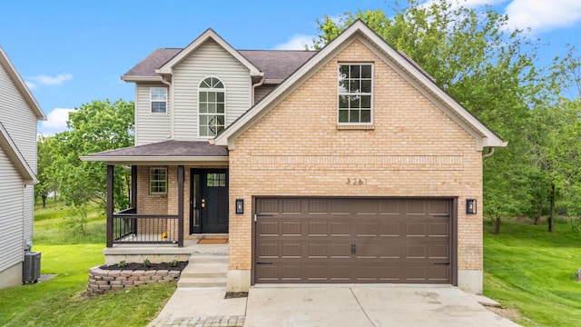3261 Royal Troon Rd, Lexington, KY 40509 - view of front of home with brick siding, a front lawn, driveway, and roof with shingles