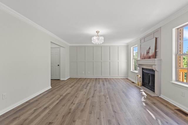 3261 Royal Troon Rd, Lexington, KY 40509 - unfurnished living room with light wood finished floors, a fireplace with raised hearth, a chandelier, baseboards, and ornamental molding