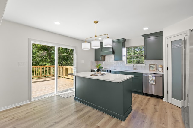 3261 Royal Troon Rd, Lexington, KY 40509 - kitchen with dishwasher, light countertops, backsplash, light wood-style flooring, and hanging light fixtures