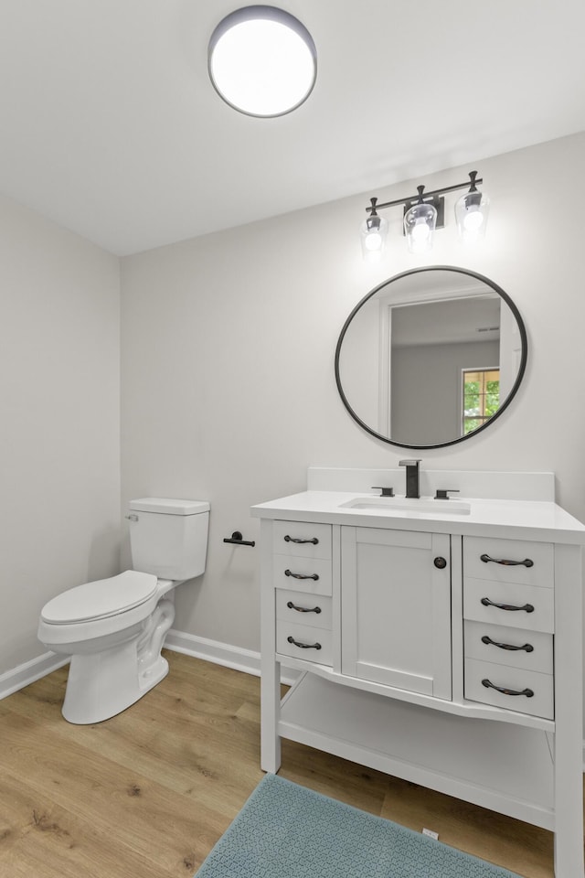 3261 Royal Troon Rd, Lexington, KY 40509 - bathroom featuring vanity, toilet, wood finished floors, and baseboards