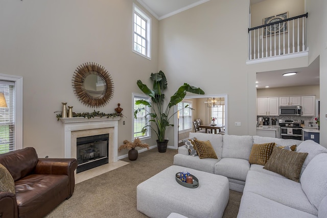 3789 Ridge View Way, Lexington, KY 40509 - carpeted living area featuring a towering ceiling, a sink, a fireplace, ornamental molding, and baseboards