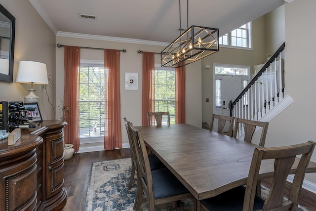 3789 Ridge View Way, Lexington, KY 40509 - dining space featuring a chandelier, dark wood-style floors, ornamental molding, baseboards, and stairs