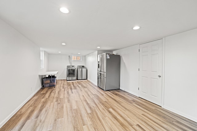680 Beaumont Ave, Harrodsburg, KY 40330 - unfurnished living room featuring washer and dryer, light wood-type flooring, recessed lighting, and baseboards