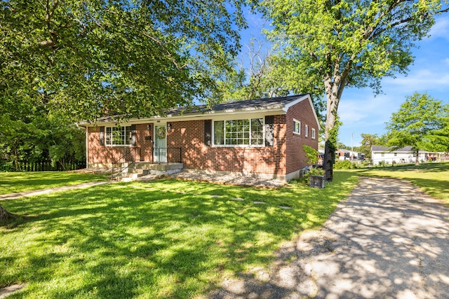 680 Beaumont Ave, Harrodsburg, KY 40330 - view of front of house with a front lawn and brick siding