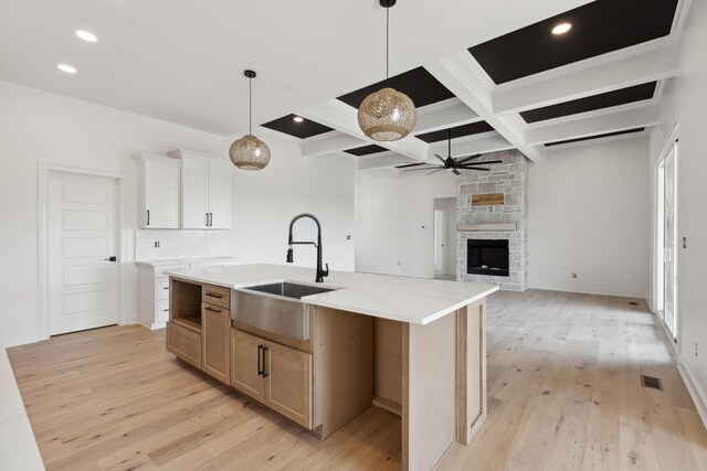 4252 Equestrian Way, Richmond, KY 40475 - kitchen with ceiling fan, coffered ceiling, light wood-type flooring, beam ceiling, and a stone fireplace