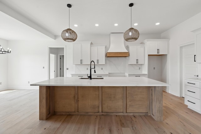 4252 Equestrian Way, Richmond, KY 40475 - kitchen featuring custom range hood, light wood finished floors, a center island with sink, white cabinets, and recessed lighting
