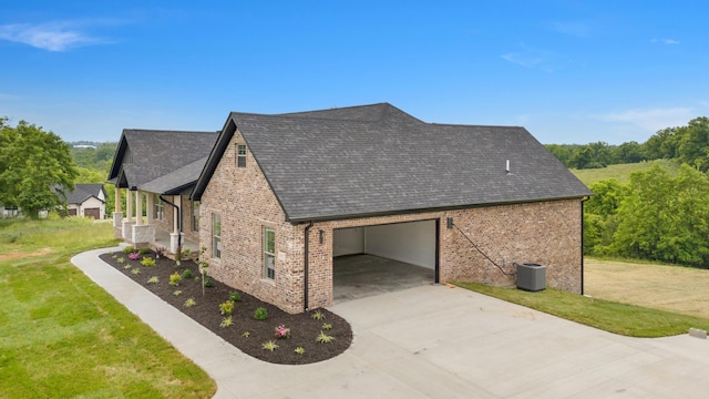 4252 Equestrian Way, Richmond, KY 40475 - view of side of home featuring driveway, brick siding, an attached garage, a shingled roof, and a lawn